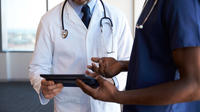 Two doctors sharing tablet